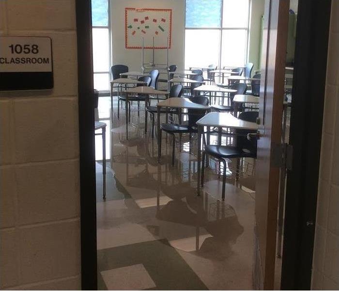 water reflecting off a classroom floor (vinyl)